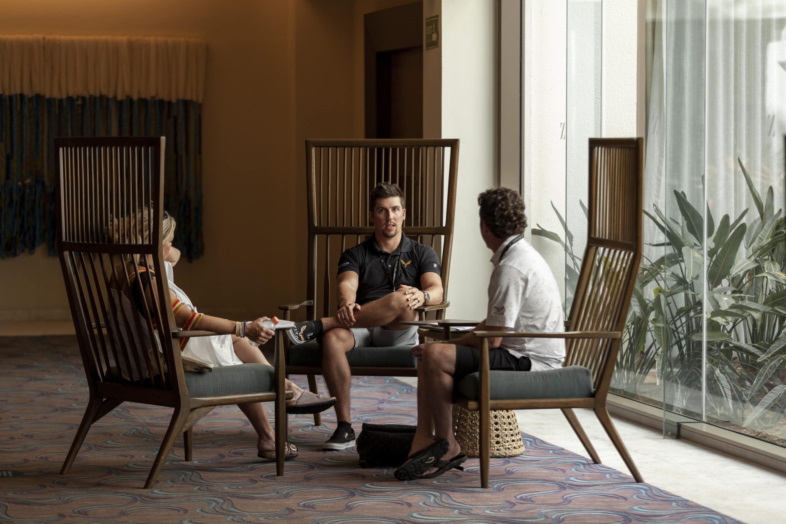 Professional coaching session with mentor guiding client for personal growth and success in a modern office setting.