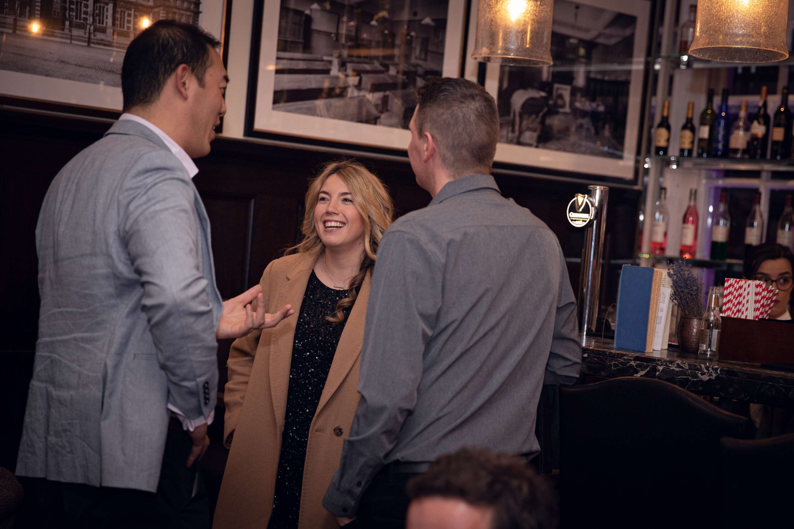 Professionals networking and exchanging ideas at SellerEvents London 2019 conference in a modern event space.