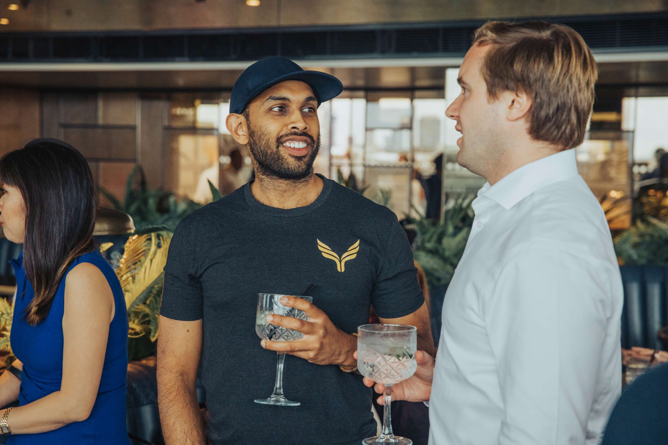 Group of professionals networking and smiling at London Meetup event, August 2021, featured in business community gathering.